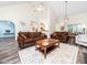 Spacious living room with high ceilings, comfortable seating, and a view of the kitchen at 65 Shorrey Pl, Youngsville, NC 27596