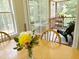 Indoor view of flower arrangement and a peak to an outdoor porch setting at 65 Shorrey Pl, Youngsville, NC 27596
