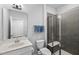 Modern bathroom with glass shower, vanity, and commode at 7117 Crested Iris Pl, Durham, NC 27703