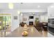 Open-concept kitchen with large island, seamlessly connecting to the living room and deck at 7117 Crested Iris Pl, Durham, NC 27703