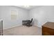 Simple office space with a desk, chair, and minimal decor, ideal for focused work at 7117 Crested Iris Pl, Durham, NC 27703