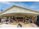 Community pavilion with outdoor seating, fireplace, and grilling area for residents at 7117 Crested Iris Pl, Durham, NC 27703
