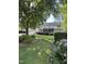 Beautiful backyard with a screened porch, well maintained lawn and landscaping at 7140 N Ridge Dr, Raleigh, NC 27615