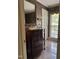 Stylish half bathroom featuring vanity with vessel sink and decorative wallpaper at 7140 N Ridge Dr, Raleigh, NC 27615