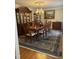Formal dining room with beautiful hardwood floors and an elegant chandelier at 7140 N Ridge Dr, Raleigh, NC 27615