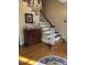 Inviting foyer with elegant staircase and hardwood floors at 7140 N Ridge Dr, Raleigh, NC 27615