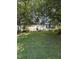 Charming traditional home with lush green lawn, mature trees, and well-maintained landscaping at 7140 N Ridge Dr, Raleigh, NC 27615