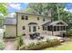 Spacious backyard with a large deck, outdoor seating, and well-maintained landscaping at 7209 St Ledger Dr, Raleigh, NC 27613