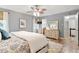 A bedroom with hardwood floors, a ceiling fan, natural lighting, and neutral walls at 7209 St Ledger Dr, Raleigh, NC 27613