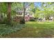 Traditional two-story home with an inviting front yard and a charming American flag waving in the breeze at 7209 St Ledger Dr, Raleigh, NC 27613