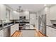 Spacious kitchen featuring stainless steel appliances, granite countertops, and a central island at 7209 St Ledger Dr, Raleigh, NC 27613