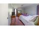 Cozy bedroom with a floral bedspread, wood dresser, and soft natural light at 764 Olivers Grove Rd, Four Oaks, NC 27524