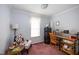 Bedroom featuring a writing desk, chair, and stylish decor at 764 Olivers Grove Rd, Four Oaks, NC 27524
