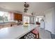 Bright, open kitchen with island seating, wood cabinetry, and modern appliances, seamlessly connected to other living areas at 764 Olivers Grove Rd, Four Oaks, NC 27524