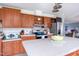 Spacious kitchen featuring wood cabinets, stainless steel appliances, and a central island with ample countertop space at 764 Olivers Grove Rd, Four Oaks, NC 27524