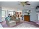 Comfortable living room with a view into the dining room and kitchen beyond at 764 Olivers Grove Rd, Four Oaks, NC 27524