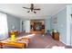 Spacious living room featuring a built-in entertainment center, comfortable seating, and ample natural light at 764 Olivers Grove Rd, Four Oaks, NC 27524