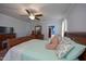 Bright bedroom with a comfortable bed, dresser, and soothing color scheme, creating a peaceful atmosphere for rest at 764 Olivers Grove Rd, Four Oaks, NC 27524