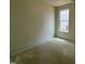 A cozy bedroom with a single window offering natural light and a view of the surrounding neighborhood at 798 Old Station Pointe, Angier, NC 27501