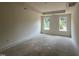 Spacious bedroom with trey ceiling, complemented by bright windows for natural light in the home at 798 Old Station Pointe, Angier, NC 27501