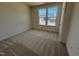Cozy bedroom with carpeted floors, natural light, and neutral paint at 798 Old Station Pointe, Angier, NC 27501