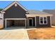 Charming home featuring a two-car garage, complementary landscaping, and craftsman style architecture at 798 Old Station Pointe, Angier, NC 27501