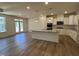 Open floor plan kitchen with island, recessed lights, and stainless appliances at 798 Old Station Pointe, Angier, NC 27501