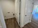 Dedicated laundry room with hookups and adjacent coat closet at 798 Old Station Pointe, Angier, NC 27501