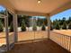 A screened in porch featuring exterior views of the homes landscaping at 798 Old Station Pointe, Angier, NC 27501