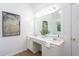 Bathroom featuring double sinks, granite countertops, and a large mirror at 8701 Erinsbrook Dr, Raleigh, NC 27617