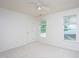 Neutral bedroom with natural light, carpet and a ceiling fan at 8701 Erinsbrook Dr, Raleigh, NC 27617