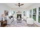 Inviting living room with fireplace, neutral furniture and bright windows at 8701 Erinsbrook Dr, Raleigh, NC 27617
