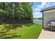 Backyard featuring a grill, a lawn, and a tall fence for enhanced privacy at 9120 Dupree Meadow Dr, Angier, NC 27501