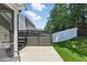 Backyard featuring a hot tub on a concrete pad, a lawn, and a privacy fence at 9120 Dupree Meadow Dr, Angier, NC 27501