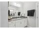 Bright bathroom featuring a framed mirror, white vanity, and gray countertop offering a clean, modern aesthetic at 9120 Dupree Meadow Dr, Angier, NC 27501