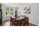 Bright dining room with modern decor, a large window, and a spacious wooden table at 9120 Dupree Meadow Dr, Angier, NC 27501