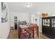 Bright dining room showcasing stylish decor, leading into a hallway with wood floors at 9120 Dupree Meadow Dr, Angier, NC 27501