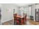 Cozy dining room with wood table, chandelier lighting, and access to the kitchen at 9120 Dupree Meadow Dr, Angier, NC 27501
