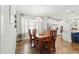 Dining room is adjacent to the kitchen, with a modern chandelier and plenty of natural light at 9120 Dupree Meadow Dr, Angier, NC 27501
