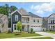 Charming two-story home with a welcoming front porch, beautiful landscaping, and a two-car garage at 9120 Dupree Meadow Dr, Angier, NC 27501