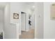 Hallway featuring neutral walls and carpet, showcasing a well-lit transition space to bedrooms at 9120 Dupree Meadow Dr, Angier, NC 27501