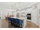 Modern kitchen featuring a large island, stainless steel appliances, and seamless flow to dining area at 9120 Dupree Meadow Dr, Angier, NC 27501