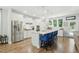 Modern kitchen with stainless steel appliances, a large island, and bright white cabinetry at 9120 Dupree Meadow Dr, Angier, NC 27501