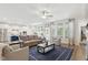Spacious open concept living room with fireplace, ceiling fan, and lots of natural light at 9120 Dupree Meadow Dr, Angier, NC 27501