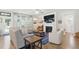 Comfortable living room features a fireplace, ceiling fan, and large windows at 9120 Dupree Meadow Dr, Angier, NC 27501