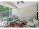 Relaxing screened patio with comfortable seating and an overhead ceiling fan at 9120 Dupree Meadow Dr, Angier, NC 27501