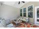 Relaxing screened patio with comfortable seating and overhead ceiling fan at 9120 Dupree Meadow Dr, Angier, NC 27501