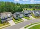 An elevated view of beautiful two-story homes with landscaped yards and driveways lined with green grass at 9120 Dupree Meadow Dr, Angier, NC 27501