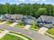 A gorgeous street view of beautiful two-story homes with landscaped yards and driveways lined with green grass at 9120 Dupree Meadow Dr, Angier, NC 27501