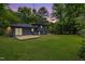 Renovated two story home with a new wooden deck and expansive lush green lawn at 939 Clarion Dr, Durham, NC 27705